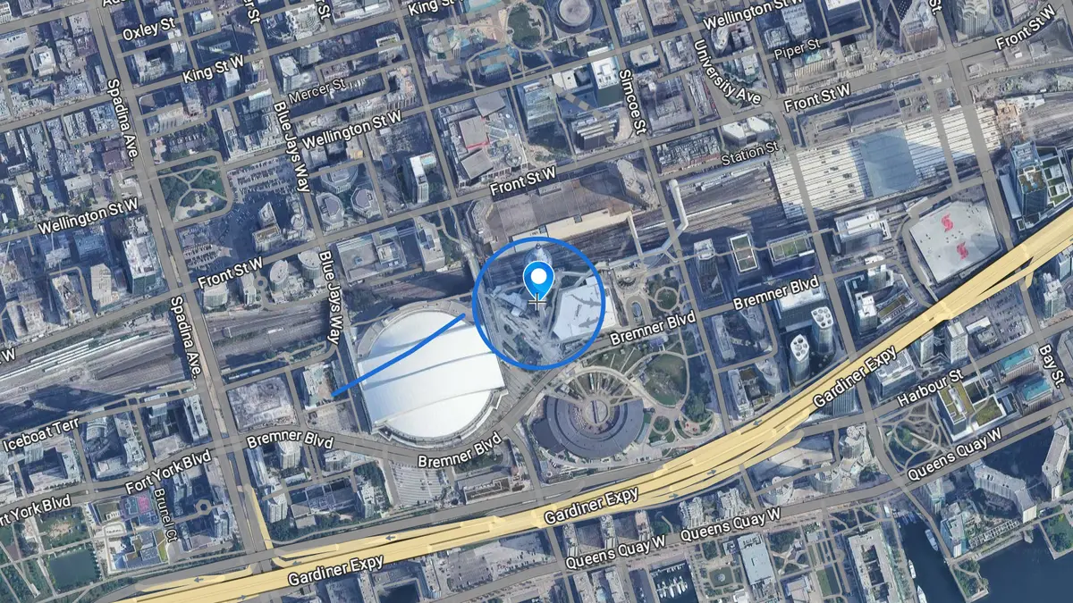 A circle, a marker and a route that an AI agent drew on satellite imagery of the CN Tower